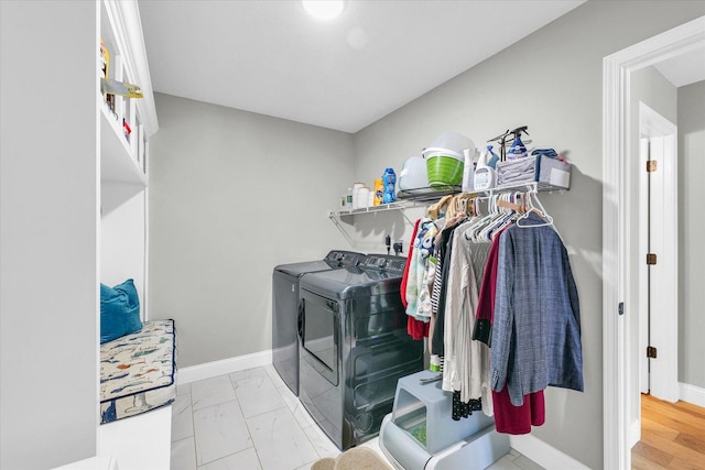 7 Connor Ct, Monticello, IL 61856 - laundry room with washer and clothes dryer, baseboards, and marble look tiles