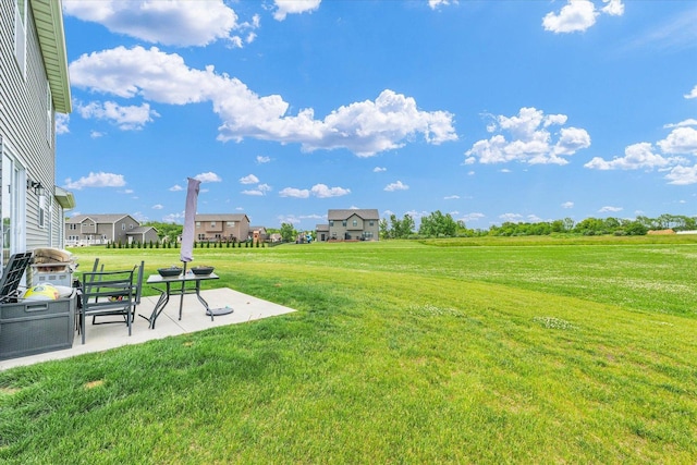 7 Connor Ct, Monticello, IL 61856 - view of green lawn with a patio area