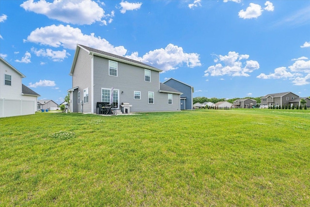 7 Connor Ct, Monticello, IL 61856 - back of property with a lawn, a patio area, and a residential view