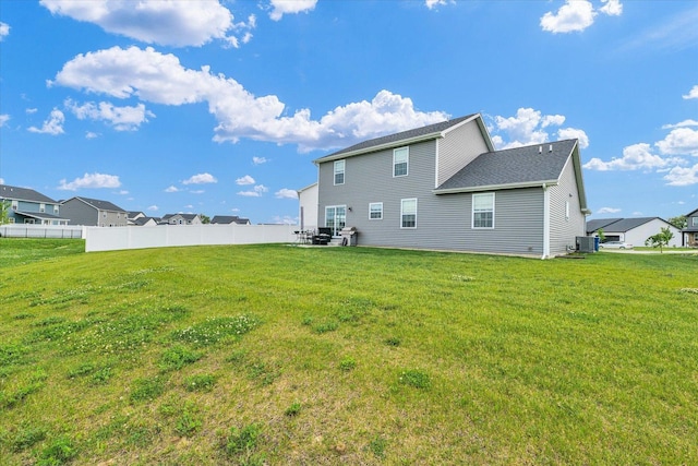 7 Connor Ct, Monticello, IL 61856 - rear view of property featuring central AC and a shingled roof