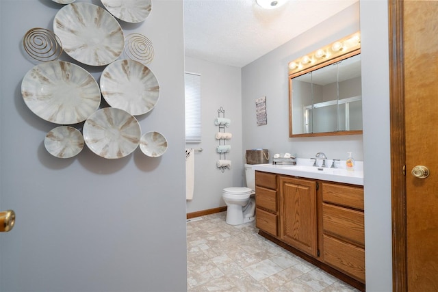 1401 Bethany Ln, Pontiac, IL 61764 - full bathroom with toilet, vanity, an enclosed shower, and baseboards