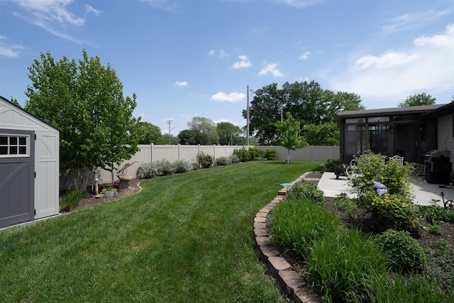 1401 Bethany Ln, Pontiac, IL 61764 - view of yard with a sunroom, a storage unit, an outdoor structure, and a patio area