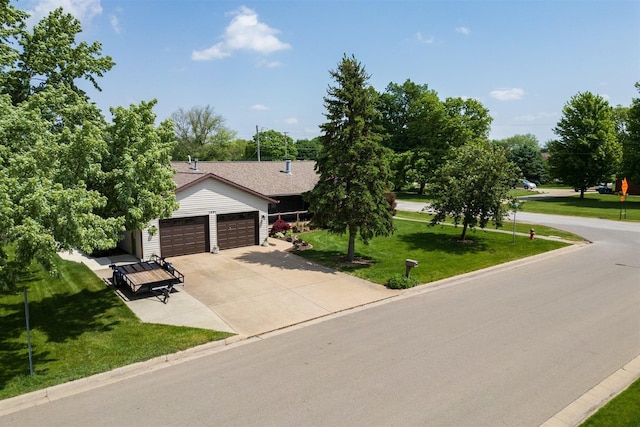1401 Bethany Ln, Pontiac, IL 61764 - view of front facade with an attached garage, a front lawn, and concrete driveway