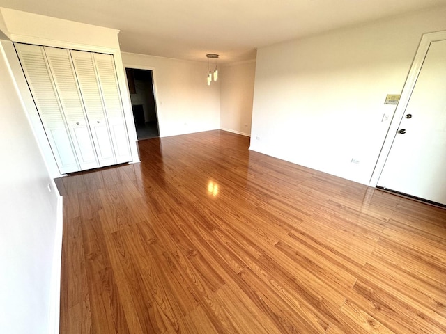 unfurnished living room with wood finished floors