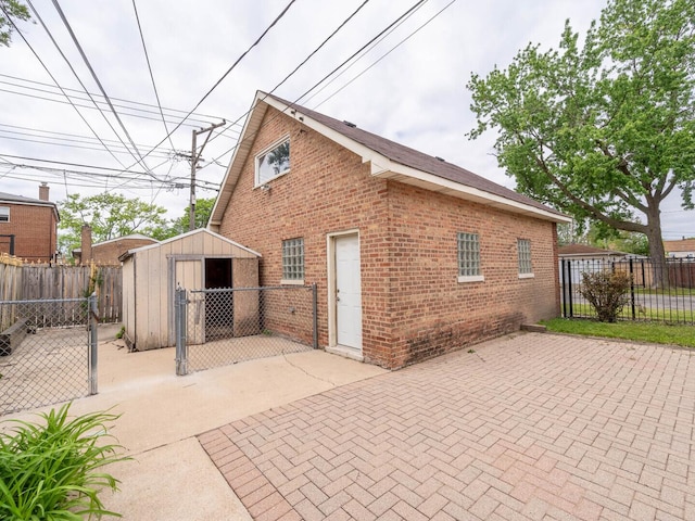 7300 S Talman Ave, Chicago, IL 60629 - rear view of property featuring brick siding, a patio area, and a fenced backyard