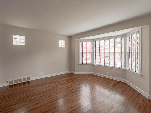 7300 S Talman Ave, Chicago, IL 60629 - spare room featuring wood finished floors, plenty of natural light, and baseboards
