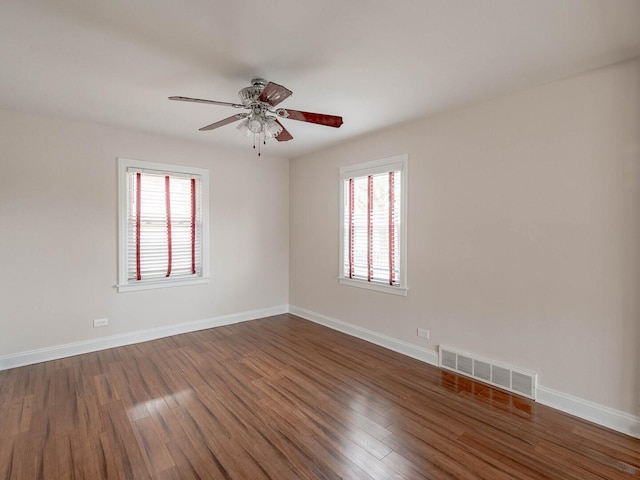 7300 S Talman Ave, Chicago, IL 60629 - empty room featuring plenty of natural light, dark wood-style flooring, and a ceiling fan