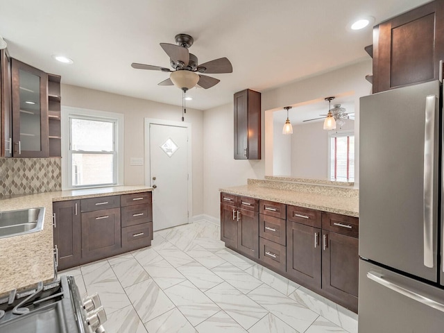 7300 S Talman Ave, Chicago, IL 60629 - kitchen with freestanding refrigerator, a ceiling fan, dark brown cabinets, open shelves, and recessed lighting