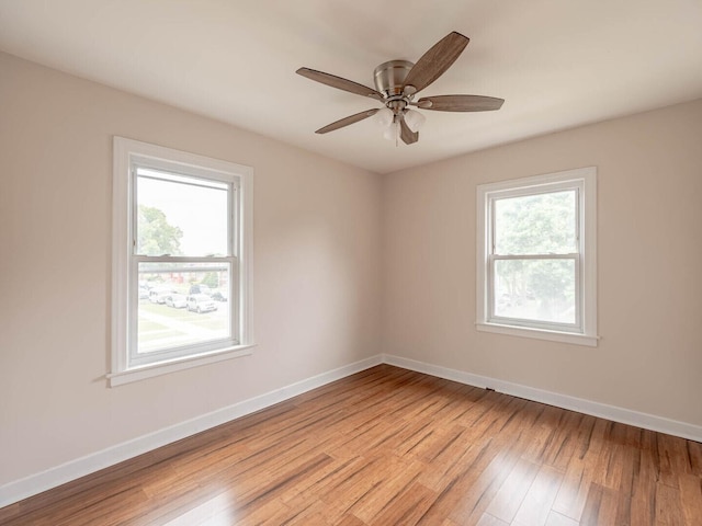 7300 S Talman Ave, Chicago, IL 60629 - unfurnished room featuring light wood-type flooring, baseboards, and a ceiling fan