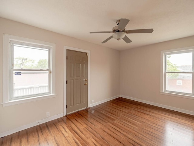 7300 S Talman Ave, Chicago, IL 60629 - empty room with light wood finished floors, baseboards, and ceiling fan