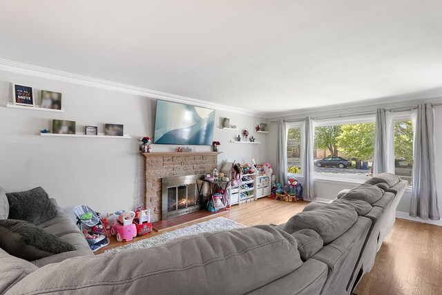 3156 W 100th St, Evergreen Park, IL 60805 - living room featuring crown molding, wood finished floors, and a fireplace