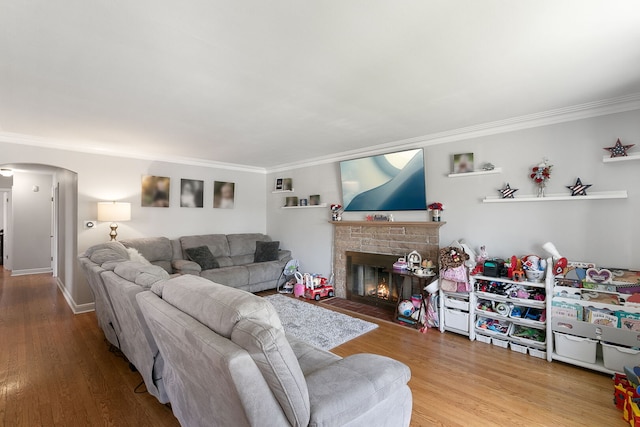 3156 W 100th St, Evergreen Park, IL 60805 - living room with crown molding, arched walkways, a fireplace, and wood finished floors
