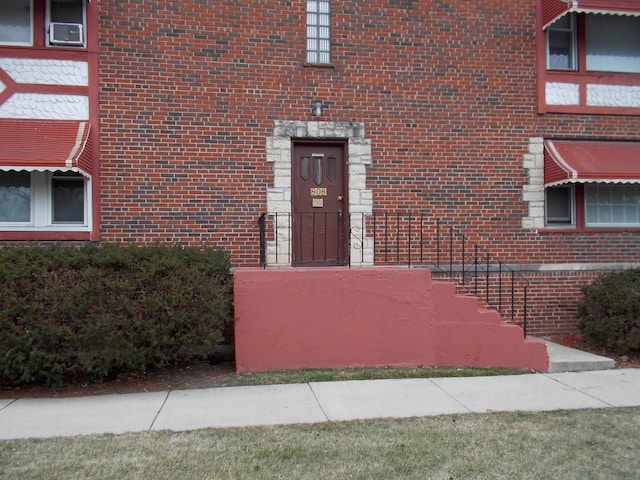 808 Bellwood Ave Unit 1N, Bellwood, IL 60104 - entrance to property featuring brick siding and cooling unit