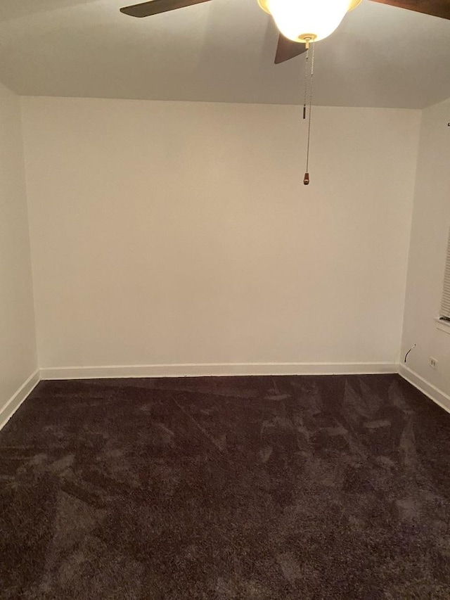 808 Bellwood Ave Unit 1N, Bellwood, IL 60104 - spare room featuring ceiling fan, dark colored carpet, and baseboards
