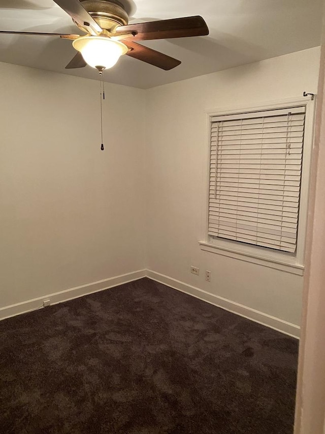 808 Bellwood Ave Unit 1N, Bellwood, IL 60104 - empty room with dark colored carpet, a ceiling fan, and baseboards