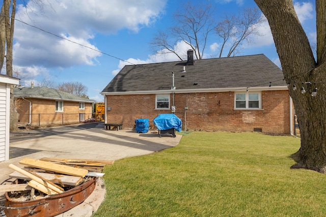 8320 Latrobe Ave, Burbank, IL 60459 - rear view of property featuring brick siding, a patio area, a shingled roof, and crawl space