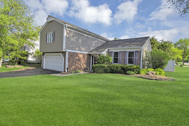 view of front of property with brick siding, driveway, a front yard, and a garage