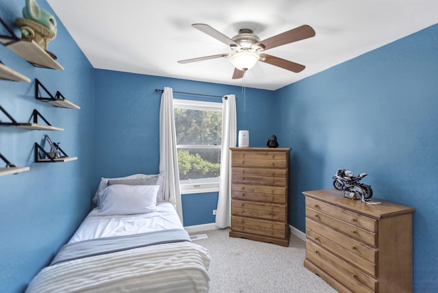 bedroom with carpet, ceiling fan, and baseboards