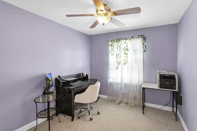 home office with a ceiling fan, baseboards, and carpet floors