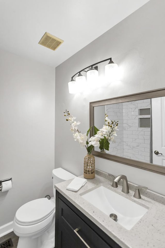 half bath with toilet and vanity