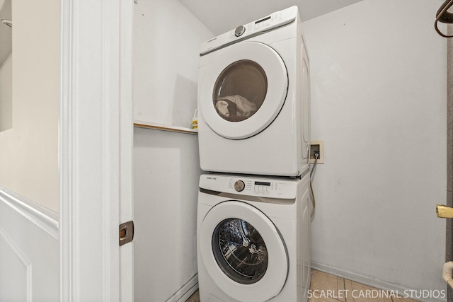105 Concord Ln, Carol Stream, IL 60188 - washroom featuring stacked washer / drying machine and light tile patterned flooring