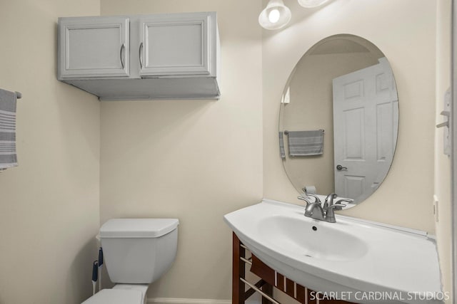105 Concord Ln, Carol Stream, IL 60188 - bathroom featuring toilet, vanity, and baseboards