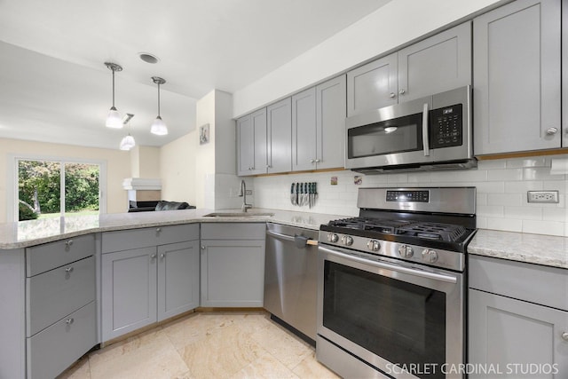 105 Concord Ln, Carol Stream, IL 60188 - kitchen with appliances with stainless steel finishes, gray cabinetry, a peninsula, and a sink