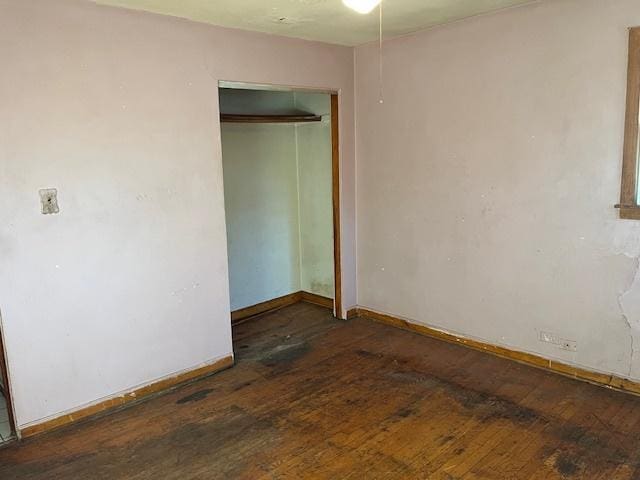 7239 W 110th St, Worth, IL 60482 - unfurnished bedroom with hardwood / wood-style flooring, baseboards, and a closet