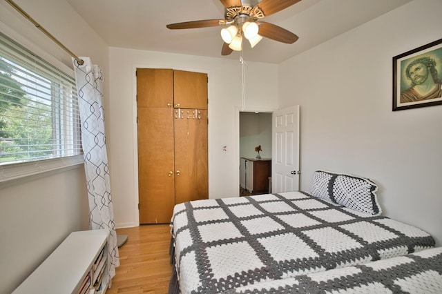 7906 Churchill St, Morton Grove, IL 60053 - bedroom featuring light wood-style floors, a closet, and a ceiling fan