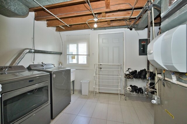 7906 Churchill St, Morton Grove, IL 60053 - washroom featuring washing machine and clothes dryer, light tile patterned floors, and electric panel