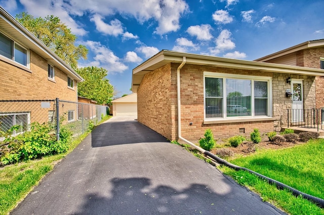 7906 Churchill St, Morton Grove, IL 60053 - view of property exterior with a detached garage, fence, an outbuilding, and brick siding