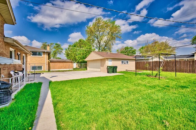 7906 Churchill St, Morton Grove, IL 60053 - view of yard with a garage, an outbuilding, and a patio area
