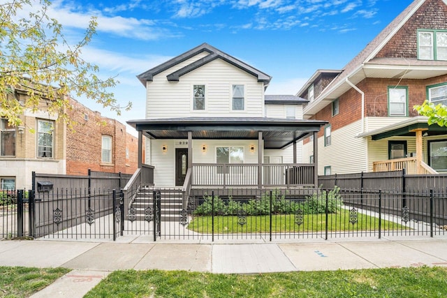 939 N Massasoit Ave, Chicago, IL 60651 - view of front of property with a porch, a fenced front yard, and a gate
