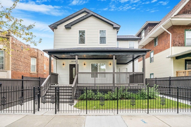 939 N Massasoit Ave, Chicago, IL 60651 - view of front facade featuring covered porch, a fenced front yard, and a gate
