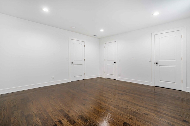 939 N Massasoit Ave, Chicago, IL 60651 - unfurnished bedroom featuring dark wood-style flooring, recessed lighting, and baseboards