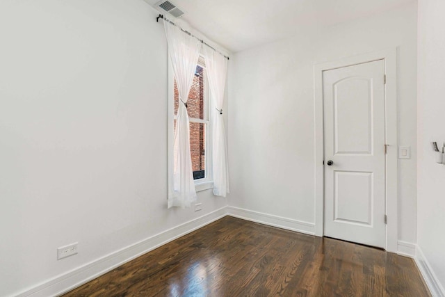 939 N Massasoit Ave, Chicago, IL 60651 - spare room featuring baseboards and dark wood finished floors