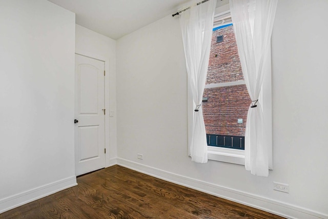939 N Massasoit Ave, Chicago, IL 60651 - unfurnished room featuring baseboards and dark wood-style floors