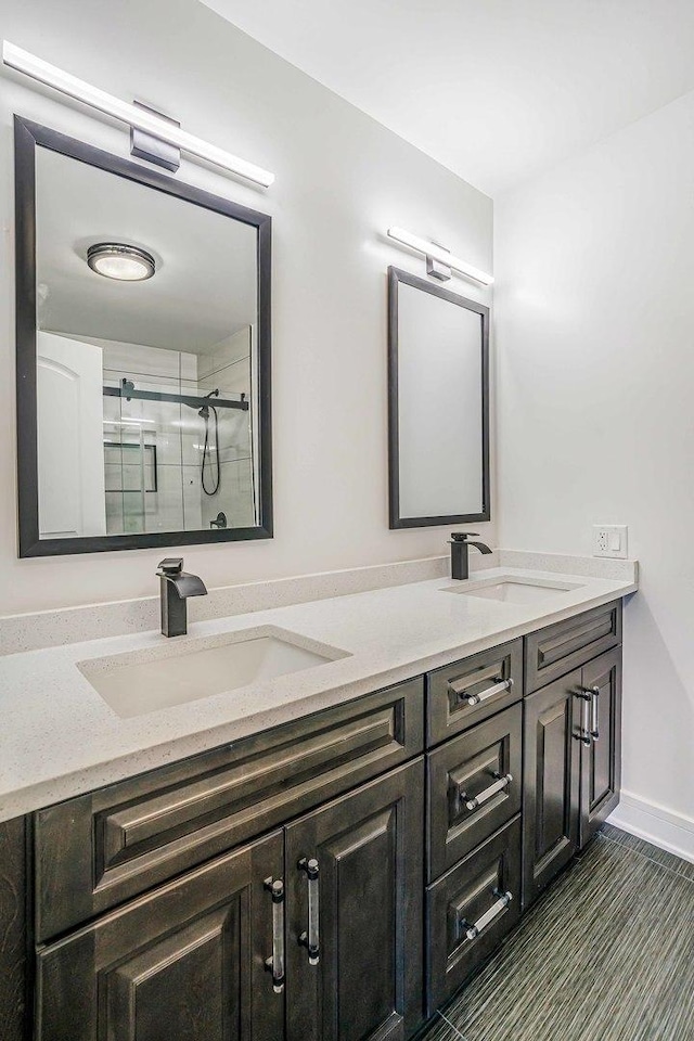 939 N Massasoit Ave, Chicago, IL 60651 - bathroom featuring a shower stall and double vanity