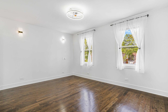 939 N Massasoit Ave, Chicago, IL 60651 - spare room with baseboards and dark wood finished floors