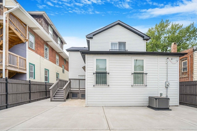 939 N Massasoit Ave, Chicago, IL 60651 - back of house with a patio, a fenced backyard, cooling unit, and a deck