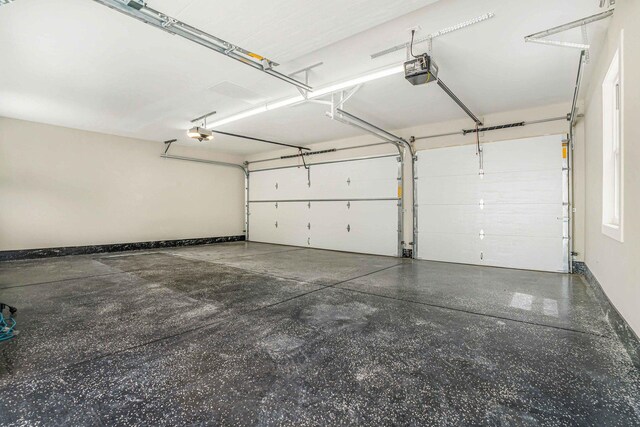 939 N Massasoit Ave, Chicago, IL 60651 - garage featuring a garage door opener