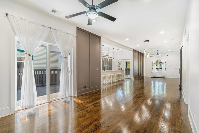 939 N Massasoit Ave, Chicago, IL 60651 - unfurnished living room with ceiling fan, dark wood-style floors, baseboards, and recessed lighting