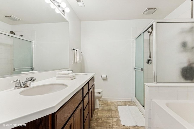 190 Birch Ln, Saint Charles, IL 60175 - bathroom with double vanity, a stall shower, toilet, a garden tub, and baseboards