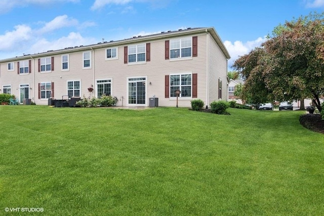 190 Birch Ln, Saint Charles, IL 60175 - back of house featuring a lawn and central AC unit