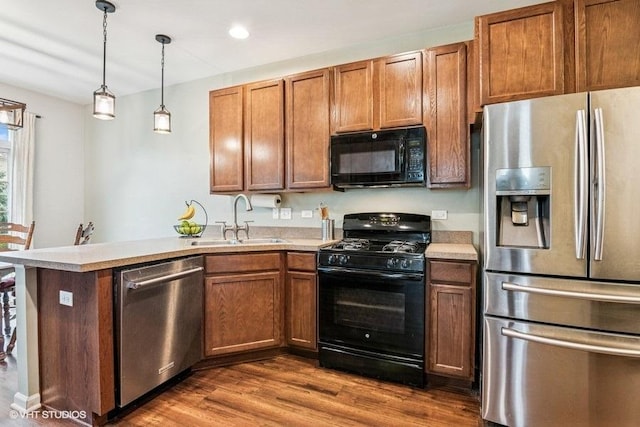 190 Birch Ln, Saint Charles, IL 60175 - kitchen featuring black appliances, a sink, light countertops, a peninsula, and recessed lighting