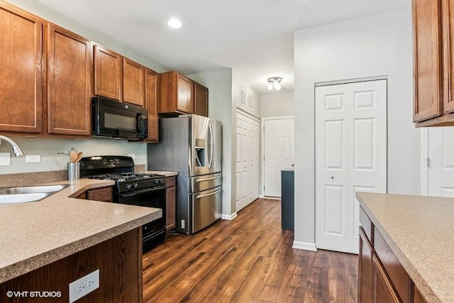 190 Birch Ln, Saint Charles, IL 60175 - kitchen with black appliances, a sink, dark wood finished floors, light countertops, and recessed lighting