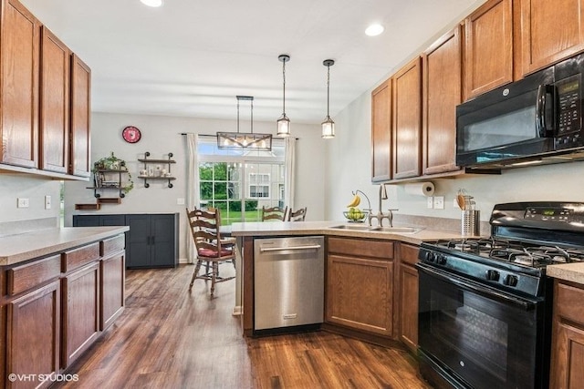 190 Birch Ln, Saint Charles, IL 60175 - kitchen featuring black appliances, a sink, a peninsula, dark wood-type flooring, and light countertops