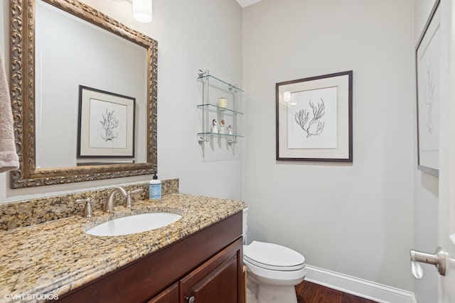 716 Kingsbrook Gln, Glen Ellyn, IL 60137 - half bath with wood finished floors, toilet, vanity, and baseboards