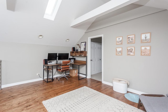 916 N Wood St Unit 3, Chicago, IL 60622 - home office featuring a skylight, wood finished floors, baseboards, and lofted ceiling