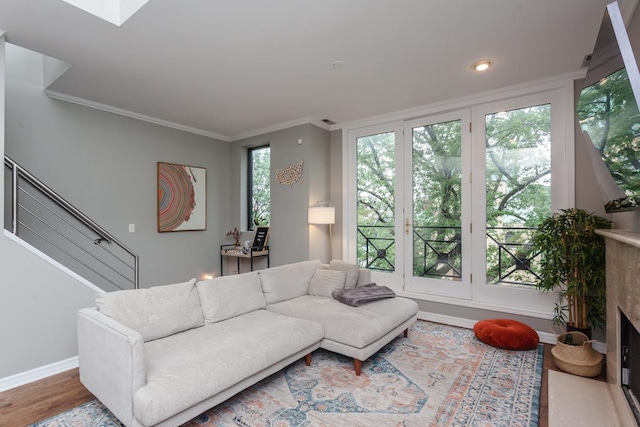 916 N Wood St Unit 3, Chicago, IL 60622 - living room featuring wood finished floors, crown molding, baseboards, a fireplace, and stairway